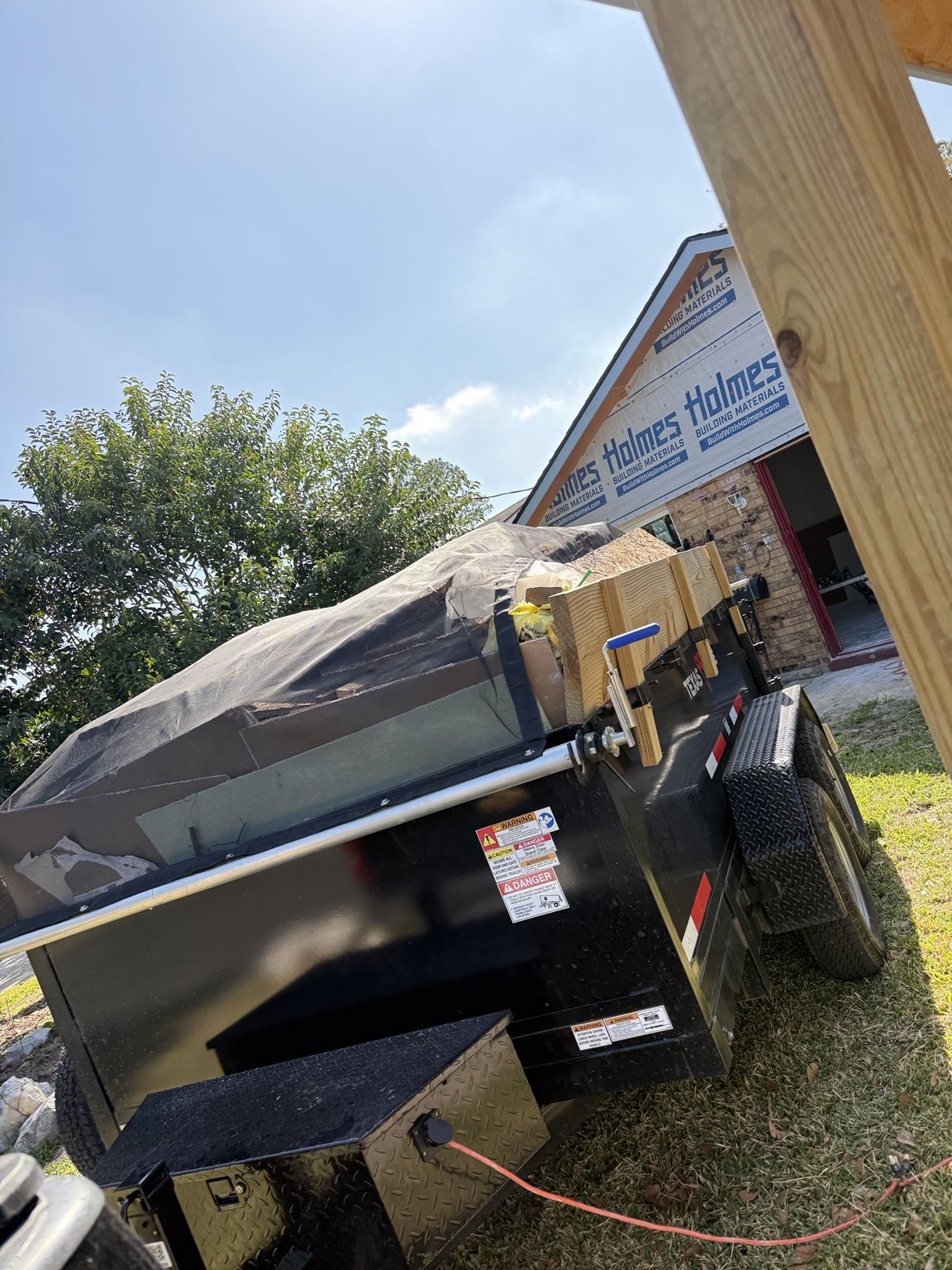 Our dump trailer loaded with renovation debris